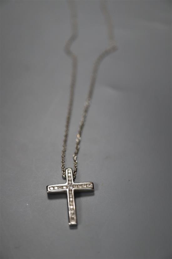 A modern 18ct white gold and diamond set cross pendant, 24mm, on an 18ct white gold chain, gross 4.4 grams.